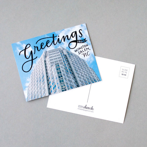 Greetings from Winston-Salem, NC. Postcard by Em Dash Paper Co, featuring the iconic downtown Wells Fargo building.