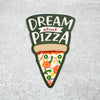 Die-cut pizza sticker with hand lettered 