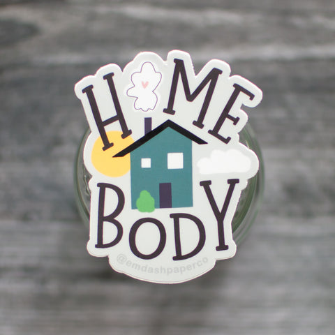 Home body vinyl sticker for all the introverts out there. Featuring playful hand-lettered serif text and a cute little house illustration. By Em Dash Paper Co.