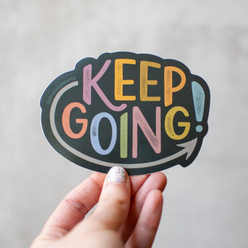Keep going! Hand-lettered sticker in weather-resistant vinyl. Designed by Em Dash Paper Co and printed locally in Winston-Salem, NC.