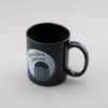 Black ceramic mug with the Wells Fargo tower in Winston-Salem, NC. Would make a great gift for a friend in the Camel City who has a sense of humor! By Em Dash Paper Co.